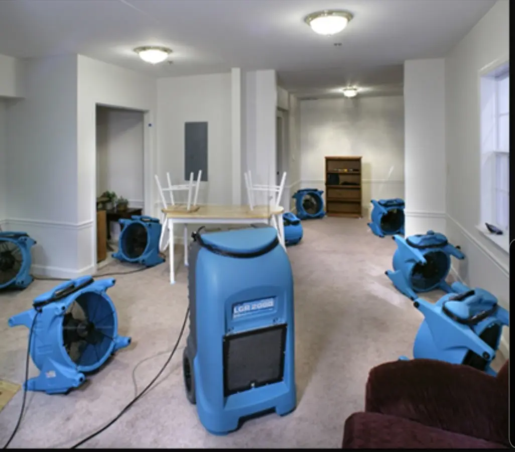 Air movers and dehumidifier setup for Water Damage Restoration in Mack